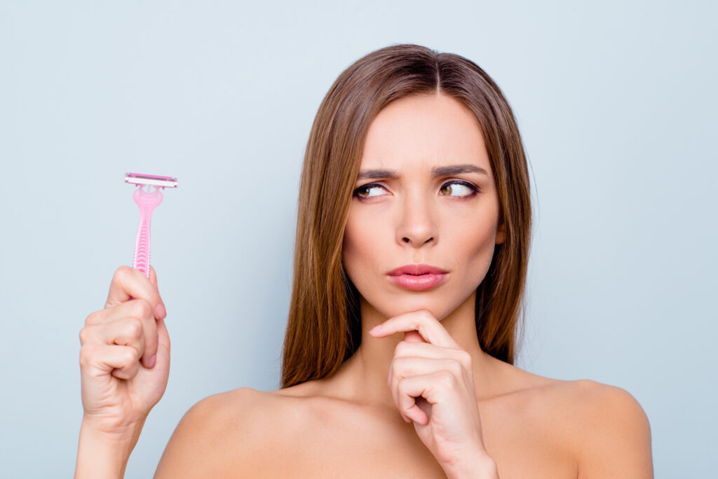 Woman unhappy with shaving, considering laser hair removal.
