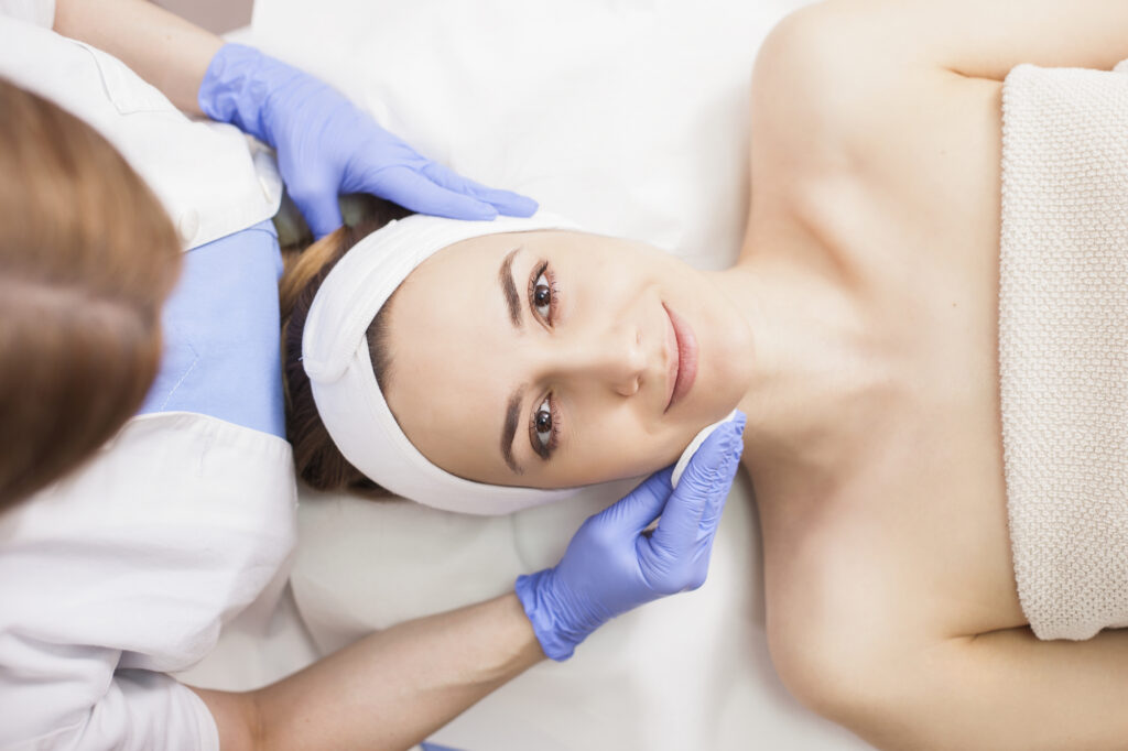 Woman receiving a professional facial treatment.