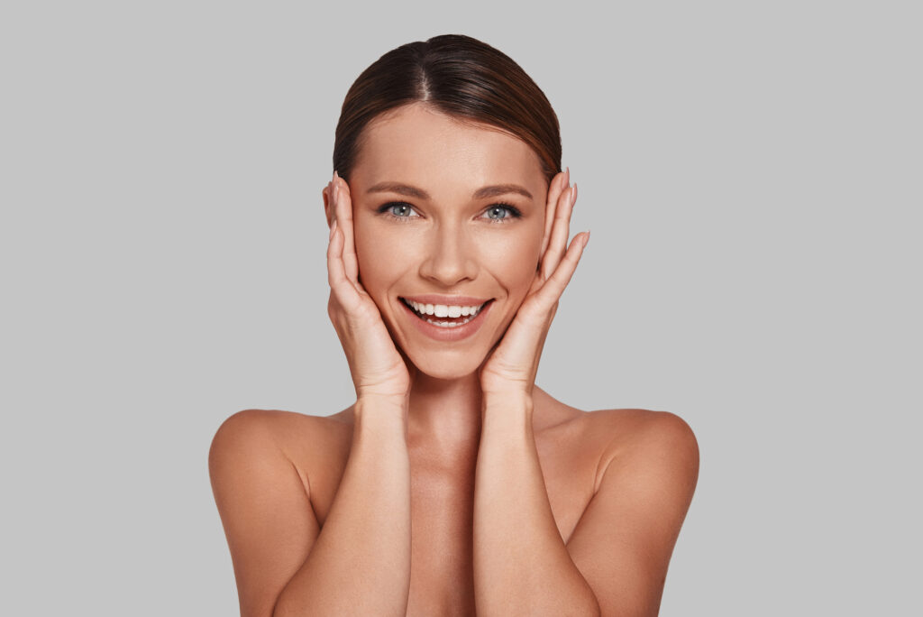 Attractive woman with smooth, young-looking skin after Botox treatment. 