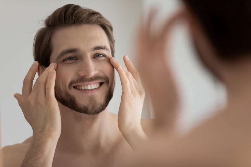 Man looking in mirror.