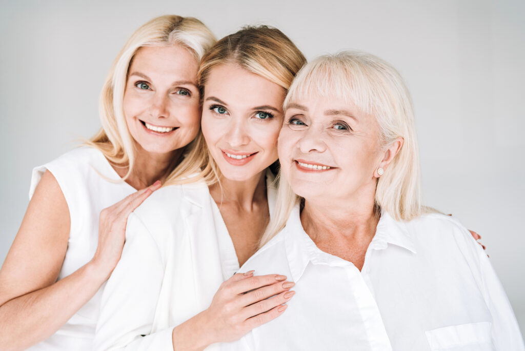 Three women of different ages with beautiful skin.