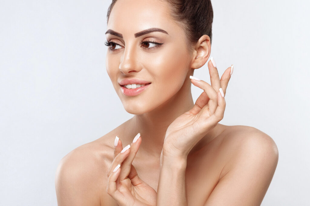 Woman smiling with beautiful, young-looking skin.