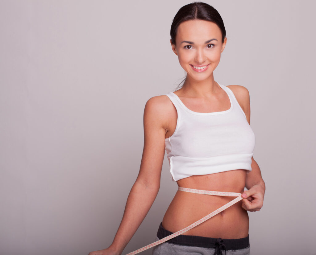Woman showing weight loss. 