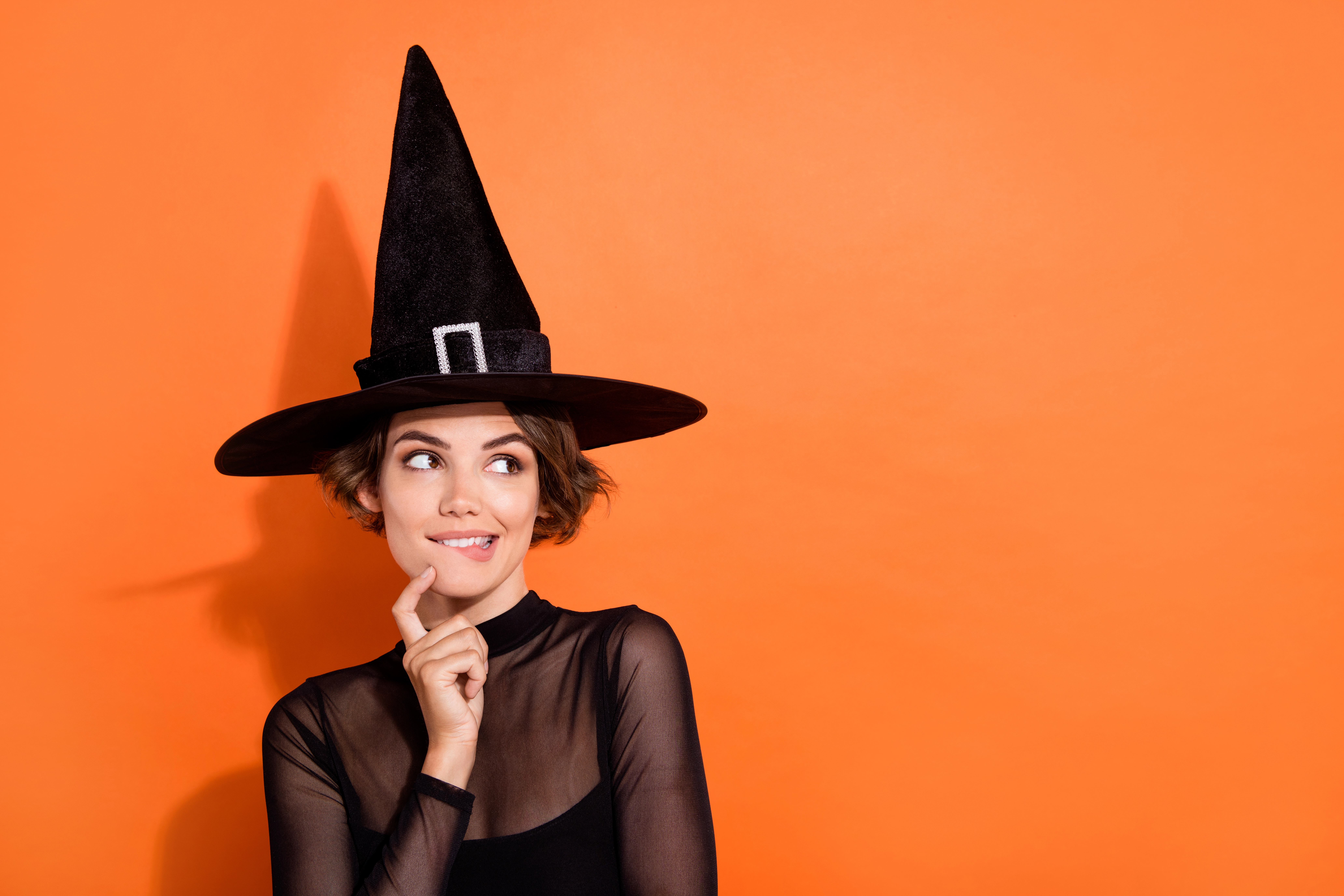 Woman in witch halloween costume.